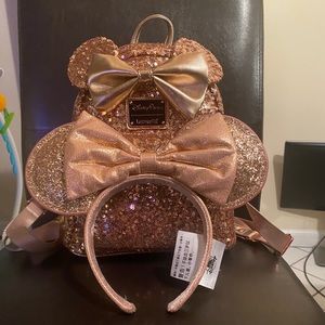 LoungeFly rose gold Disney park exclusive with matching ears.